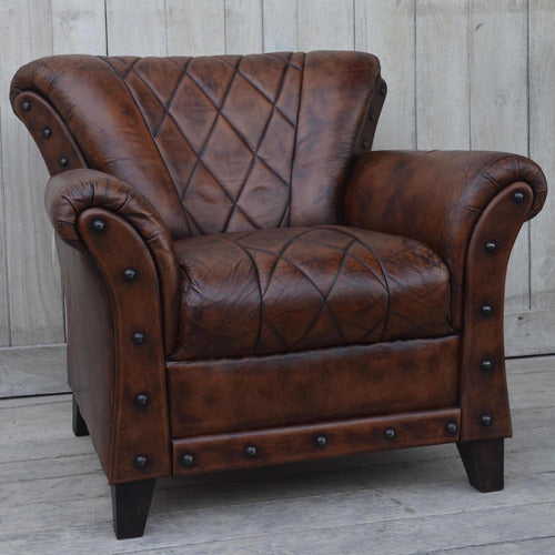 THE DECOR STORE STUDDED LEATHER ARM CHAIR